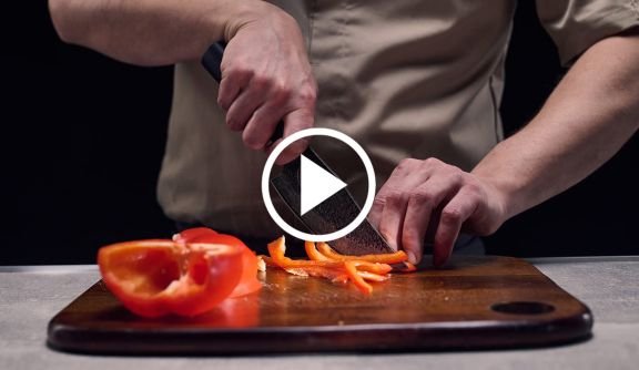 Chef slicing a red pepper with a Matsato knife